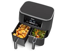 Image d'une friteuse sans huile Ninja Foodi MAX Dual Zone AF400EU, équipée de deux tiroirs de cuisson indépendants, idéale pour préparer simultanément deux plats différents avec des températures et des temps de cuisson distincts, offrant une capacité totale de 9,5 litres, parfaite pour les familles nombreuses ou les