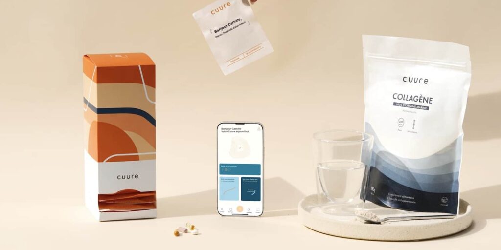 Vue d’écran du questionnaire Cuure affiché sur un ordinateur portable posé sur un bureau lumineux, avec en arrière-plan un carnet de notes, représentant le fonctionnement du diagnostic personnalisé Cuure pour recevoir des compléments alimentaires adaptés à son mode de vie.