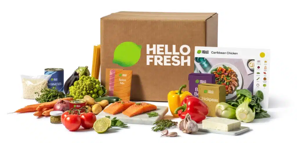 Photo d’un livreur déposant une box HelloFresh France sur le pas de porte, représentant la livraison et la simplicité du service.