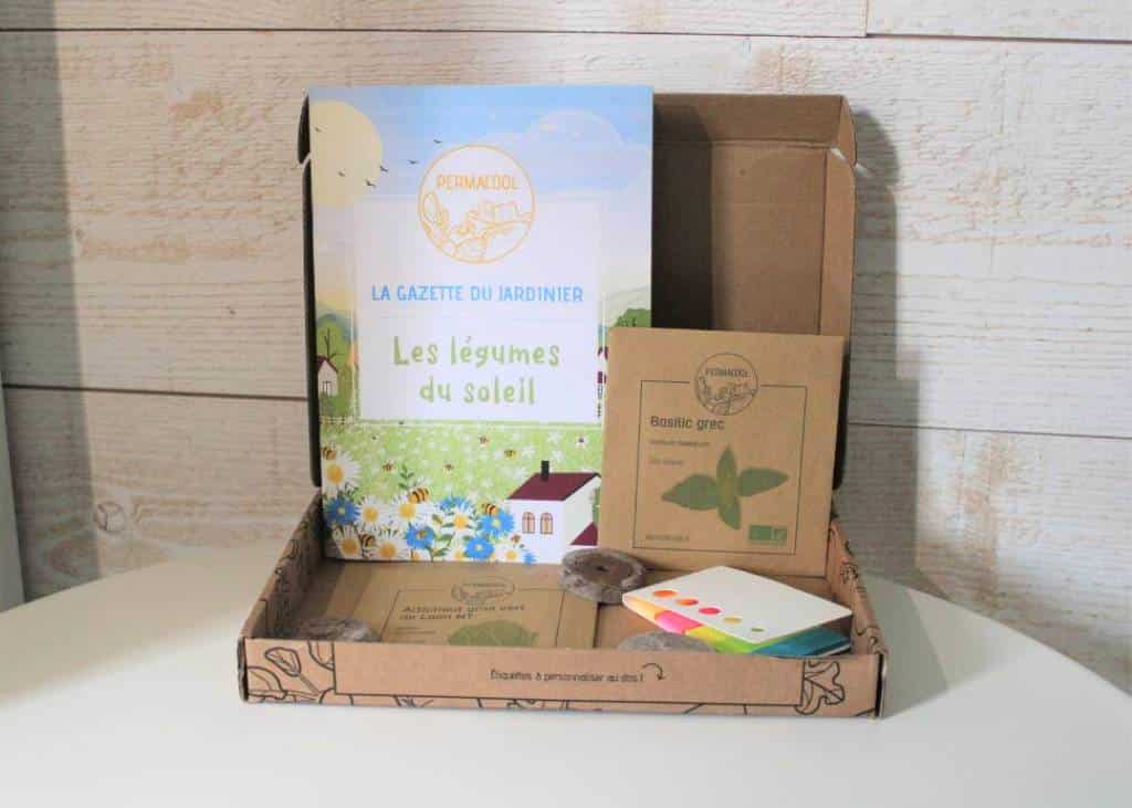 Présentation de plusieurs variétés de graines bio Permacool étalées sur une table pour illustrer l’analyse du rapport qualité prix de l’abonnement.