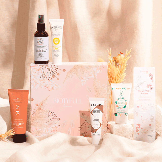 Photo représentant une sélection de produits reçus dans une Biotyfull Box dont un élixir Huygens un booster Corème Paris un masque cheveux une eau micellaire une huile nourrissante et une crème mains.