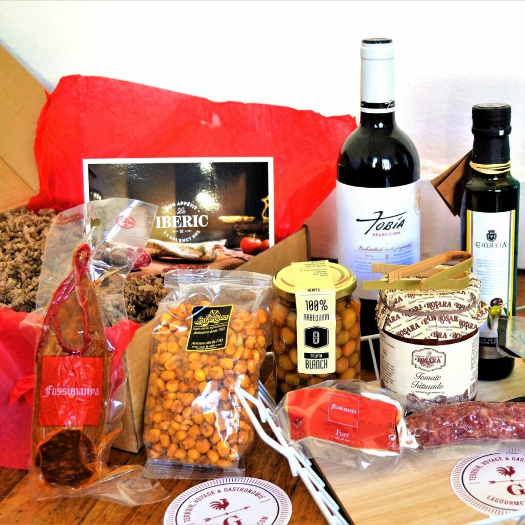 Visuel mettant en scène des produits du terroir et une ambiance épicerie fine pour présenter l’univers authentique de La Gourmet Box.