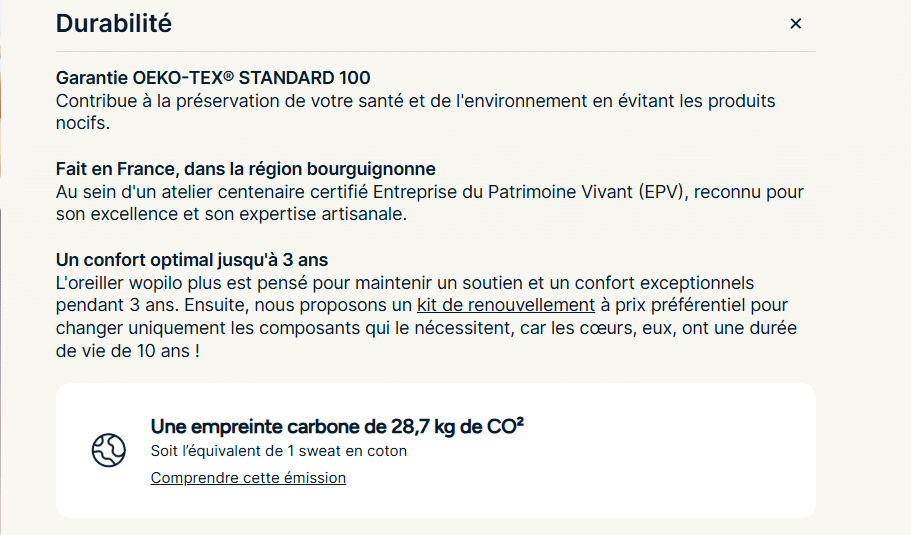 Housse en percale de coton du wopilo plus tenue en main, tissage serré à 91 fils par centimètre carré, avec l'étiquette de composition et de certification OEKO-TEX Standard 100 en arrière-plan.