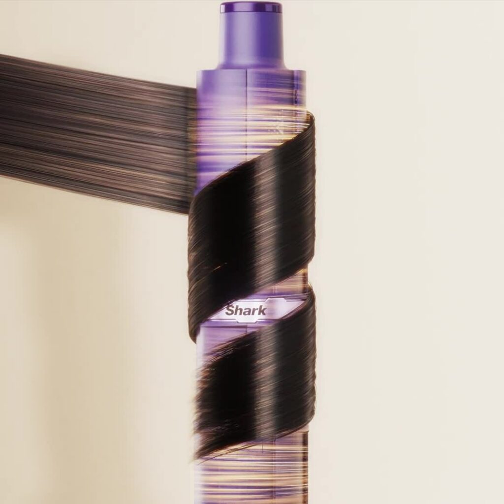 photo du multi-styler IonCurl en train de boucler une mèche à l’air devant mon miroir pour illustrer ses technologies
